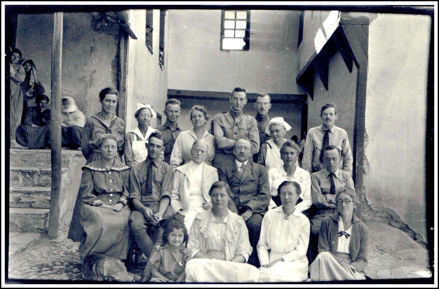 A group of people posing for a photo
Description automatically generated