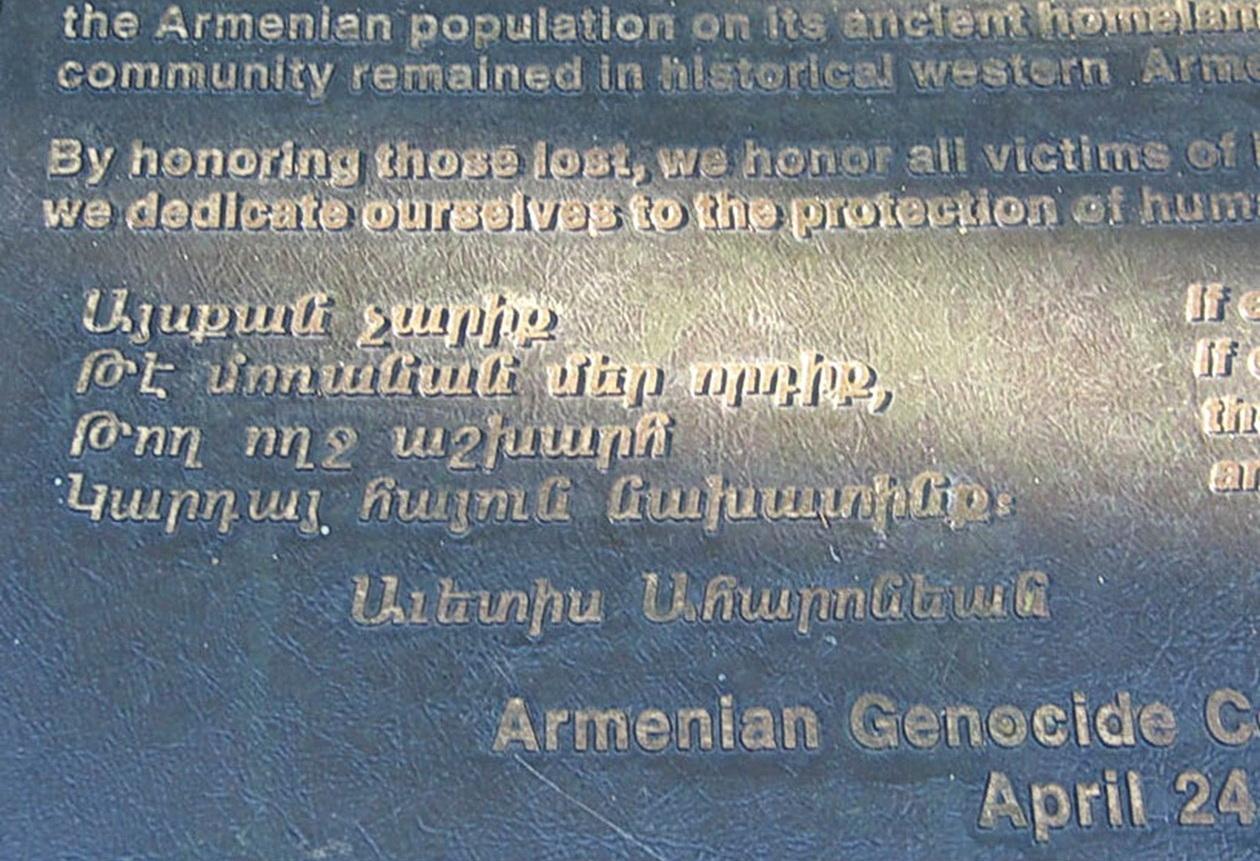 A picture containing text, plaque
Description automatically generated